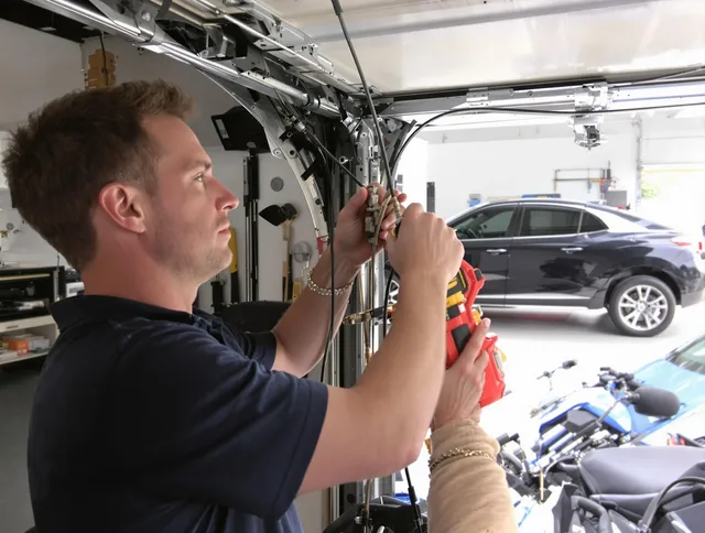 Carver Garage Door Repair safety certified technician performing cable replacement in Carver
