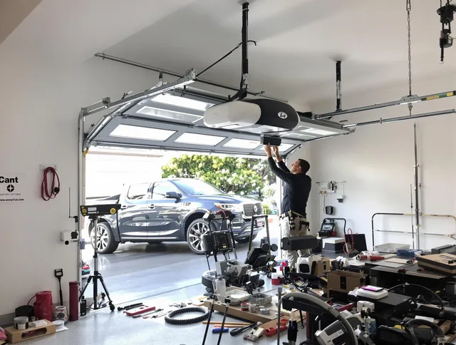 Carver Garage Door Repair specialist installing smart garage door opener system in Carver home