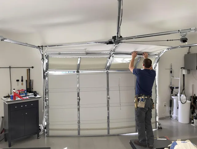 Carver Garage Door Repair specialist performing precise section replacement on Carver garage door