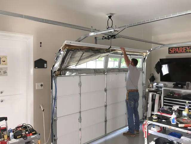 Garage door section replacement by Carver Garage Door Repair in Carver