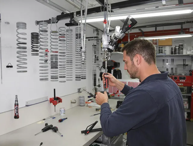 Carver Garage Door Repair safety certified technician performing precision spring replacement in Carver