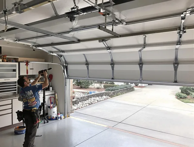 Garage door track repair service by Carver Garage Door Repair in Carver